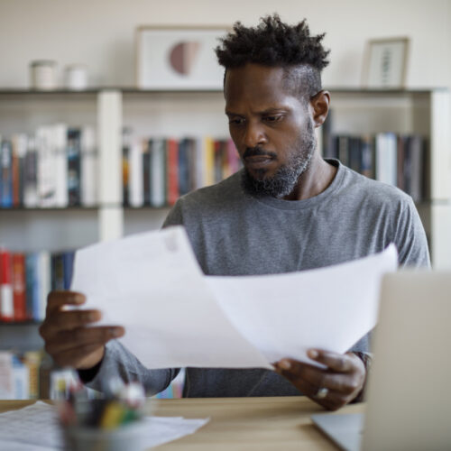 Mid adult man working at home